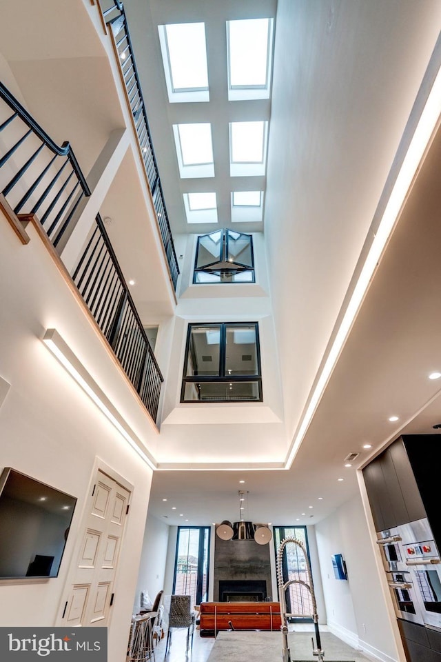 interior space with a high ceiling and a wealth of natural light