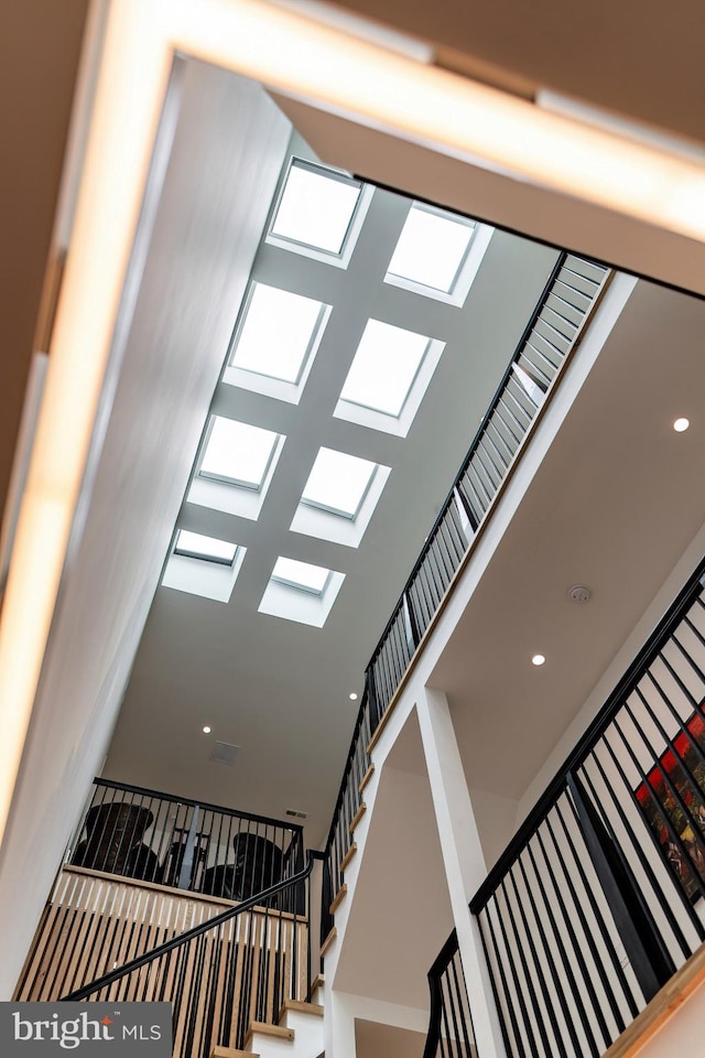 stairway with a towering ceiling