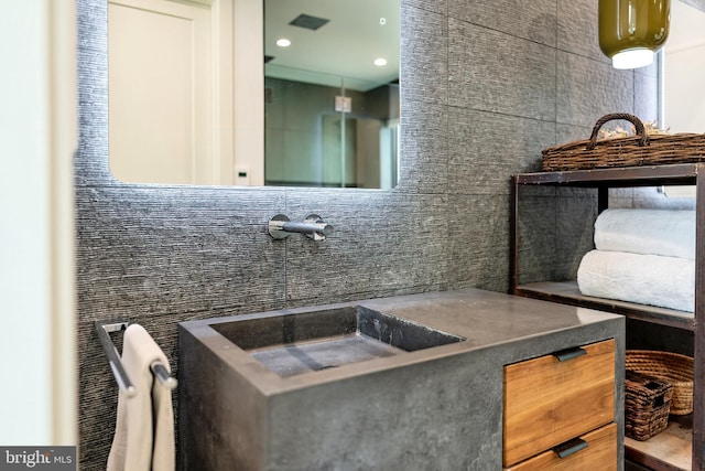 bathroom with tile walls