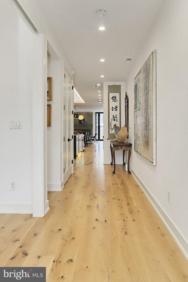 corridor featuring hardwood / wood-style flooring