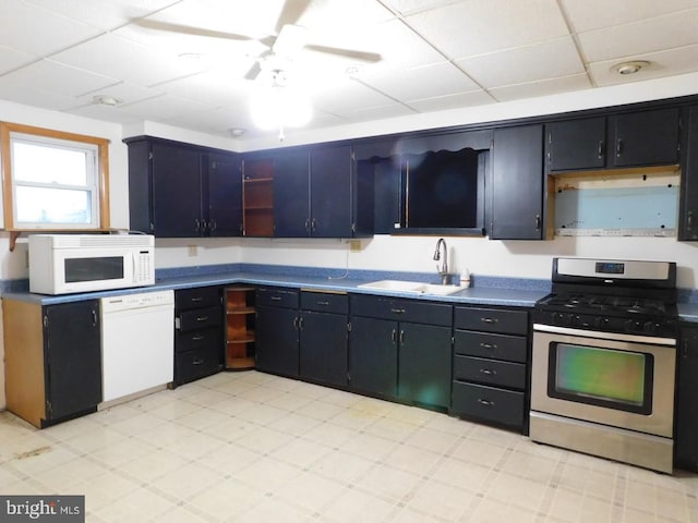 kitchen featuring a paneled ceiling, white appliances, sink, and ceiling fan