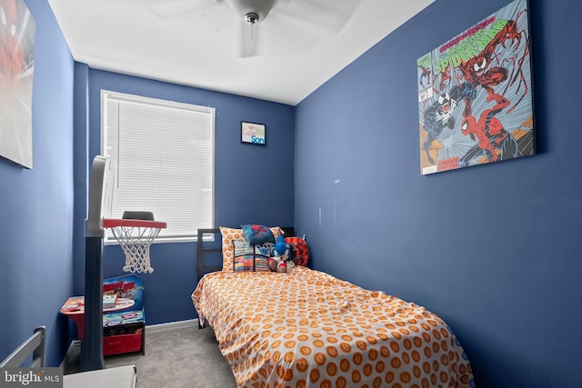 bedroom featuring ceiling fan and carpet