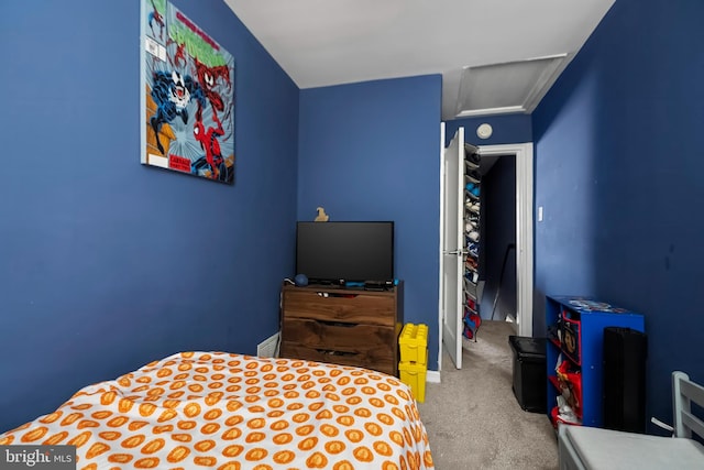 bedroom featuring light carpet