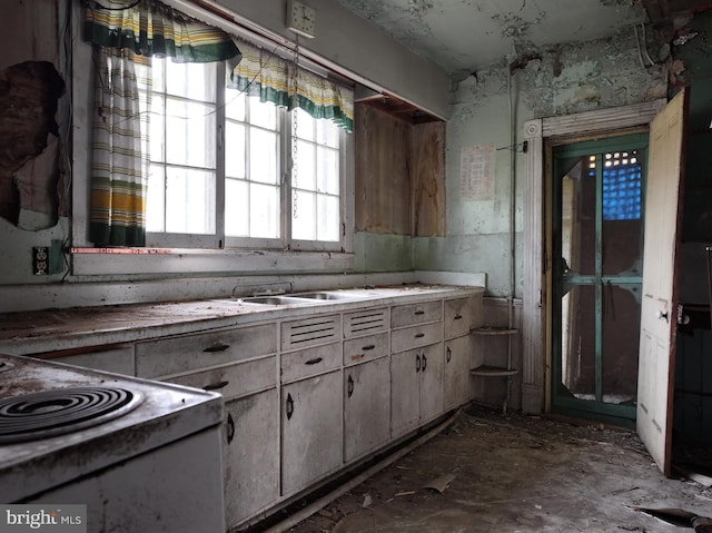 kitchen featuring sink and electric range