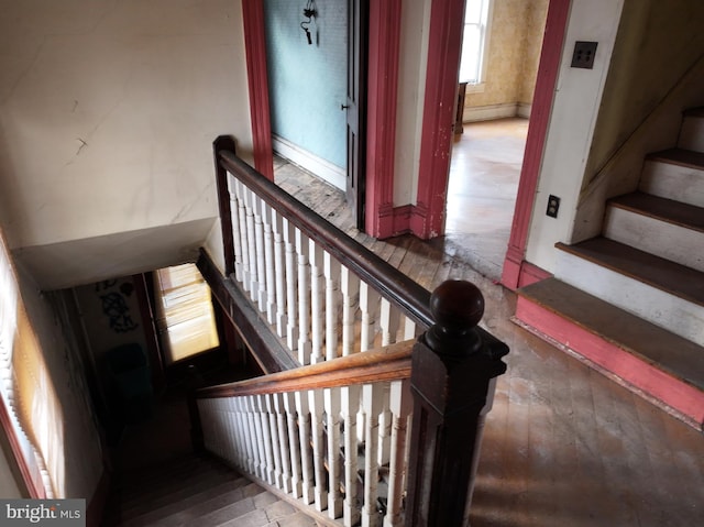 stairway featuring hardwood / wood-style flooring