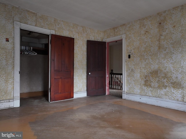 interior space featuring a closet and concrete floors