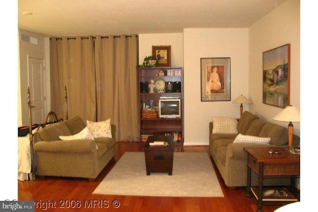 living room featuring dark hardwood / wood-style floors