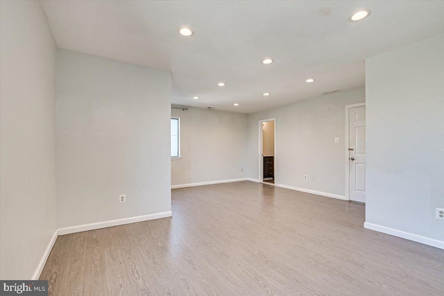 empty room with wood-type flooring