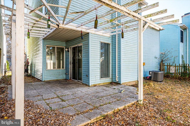 view of patio / terrace featuring central AC and a pergola