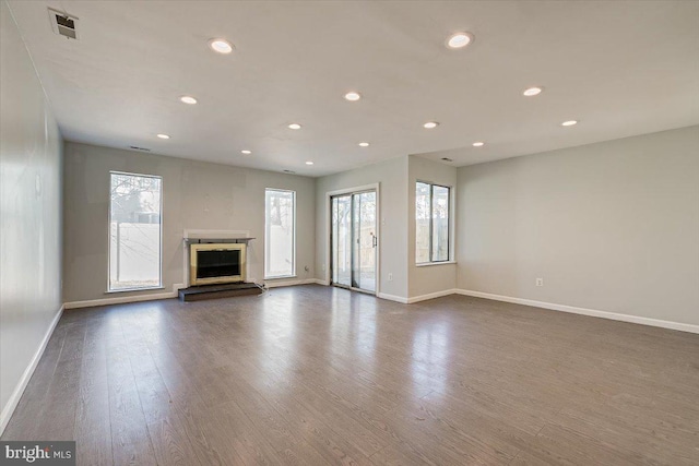 unfurnished living room featuring dark hardwood / wood-style floors