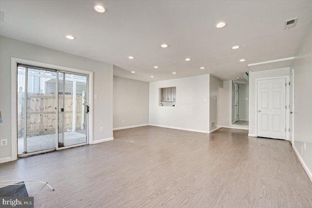 unfurnished living room featuring light wood-type flooring