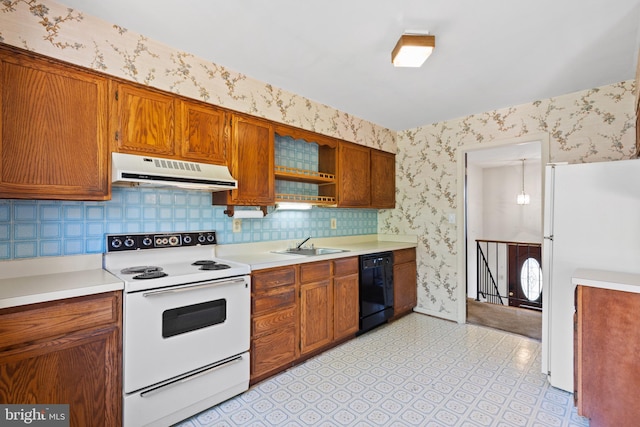 kitchen featuring white appliances and sink