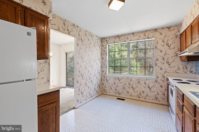 kitchen featuring white appliances