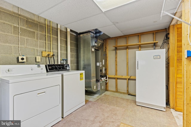 clothes washing area with separate washer and dryer