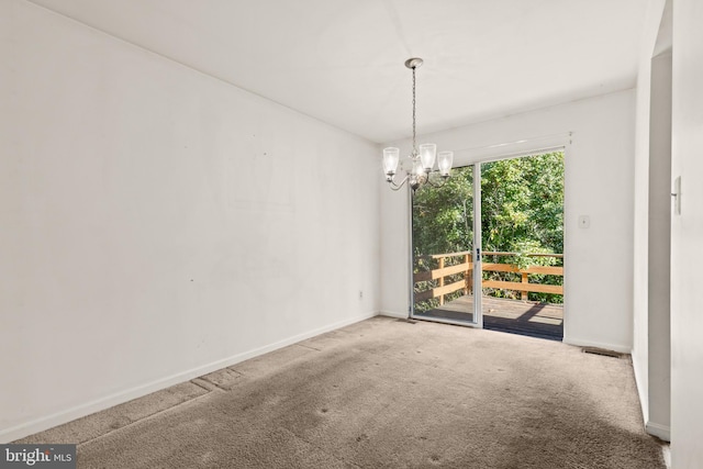 unfurnished dining area with carpet floors and an inviting chandelier