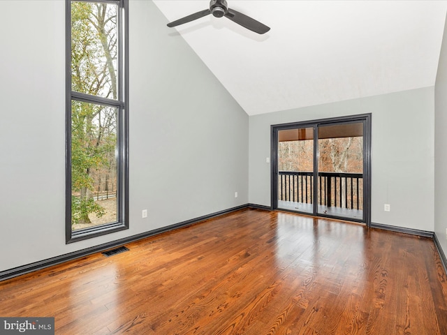 unfurnished living room with ceiling fan, hardwood / wood-style floors, and vaulted ceiling