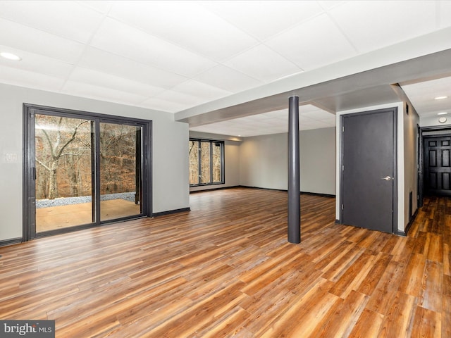 basement featuring hardwood / wood-style floors