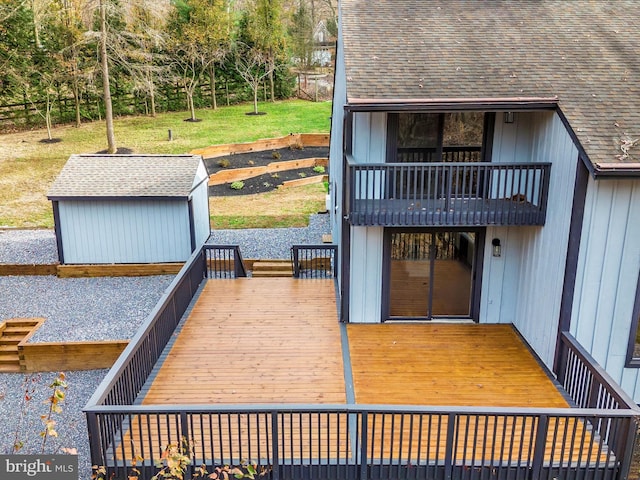 wooden deck featuring a storage unit