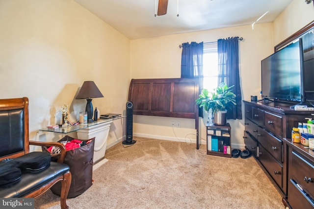 interior space with ceiling fan and light colored carpet