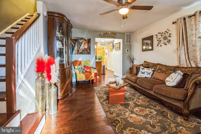 living room with ceiling fan and dark hardwood / wood-style floors