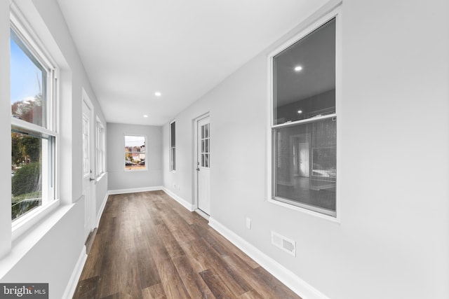 hallway featuring dark hardwood / wood-style floors