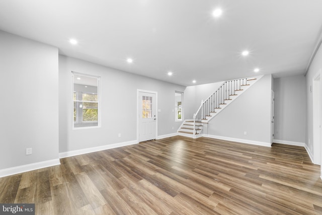 unfurnished living room with hardwood / wood-style flooring