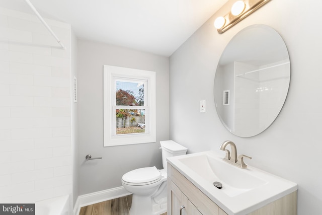 bathroom featuring hardwood / wood-style floors, vanity, and toilet