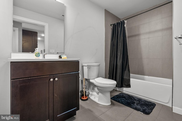 full bathroom featuring tile patterned flooring, vanity, shower / tub combo, and toilet