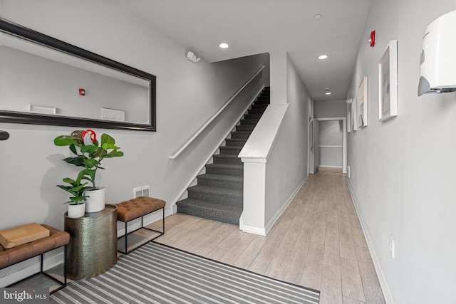 staircase with wood-type flooring