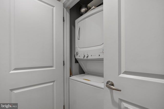 laundry room with stacked washer and clothes dryer