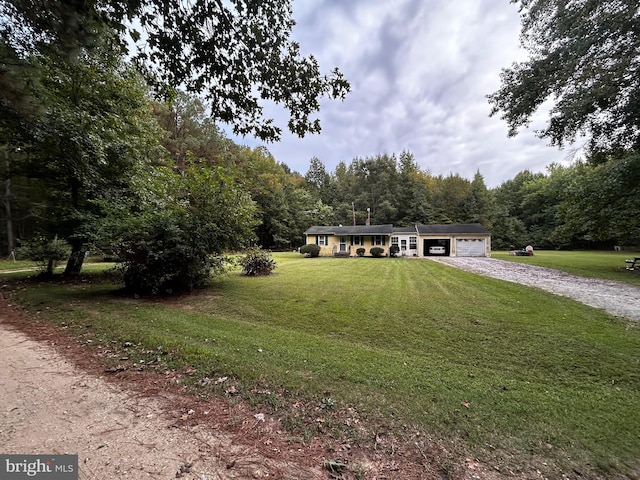 ranch-style home with a front yard and a garage