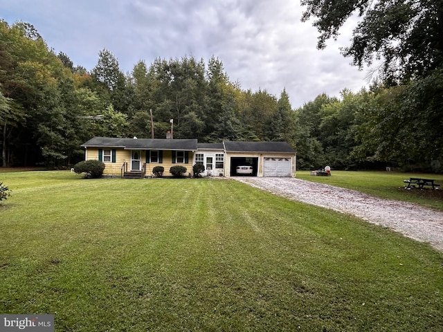 single story home with a garage and a front yard