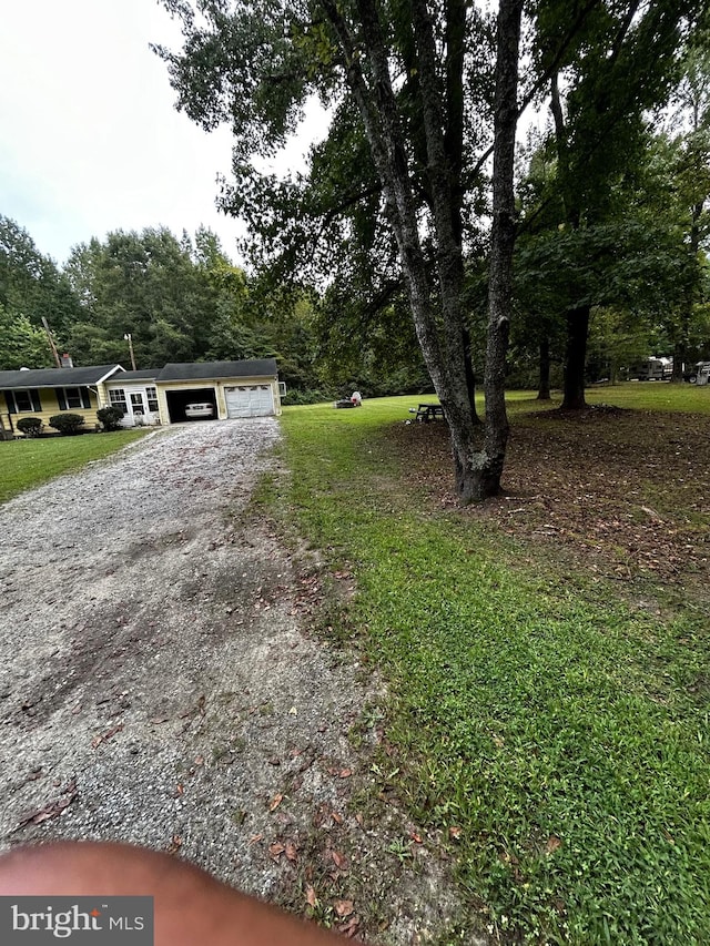 view of yard featuring a garage