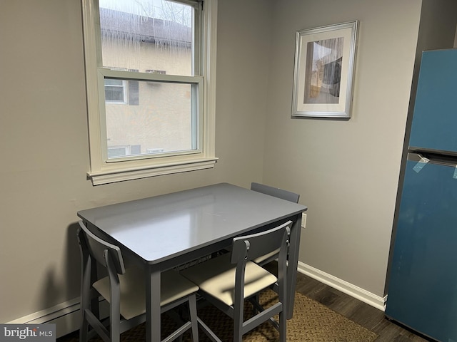 dining area featuring dark hardwood / wood-style flooring