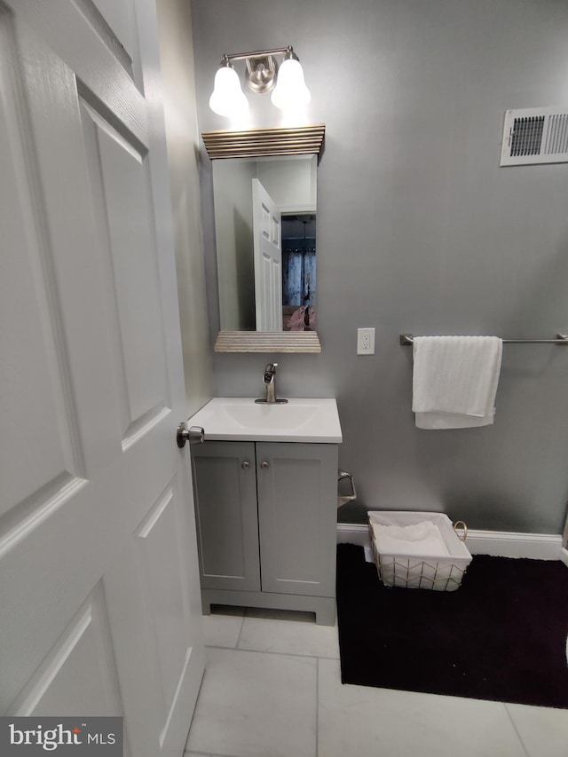 bathroom with vanity and tile patterned flooring