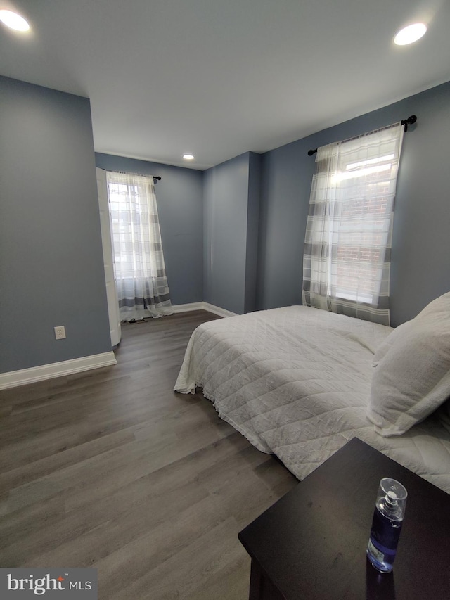 bedroom with hardwood / wood-style floors