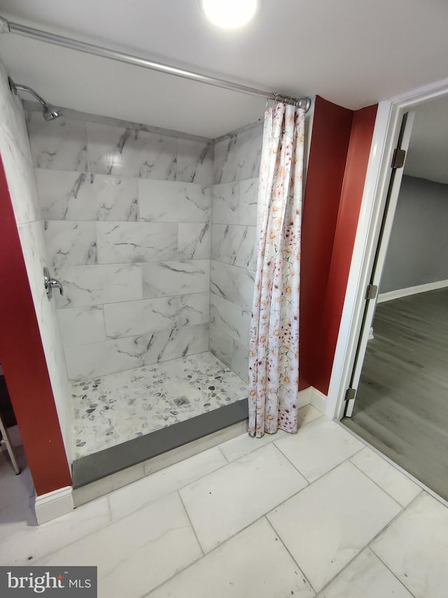 bathroom featuring curtained shower