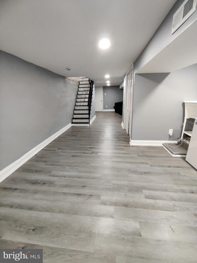 basement featuring light hardwood / wood-style floors