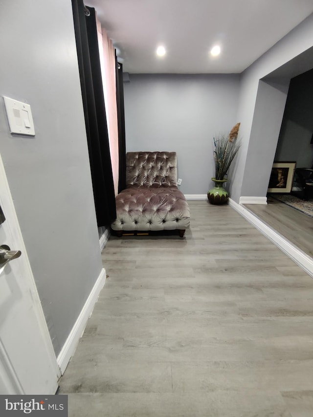 sitting room with light hardwood / wood-style flooring