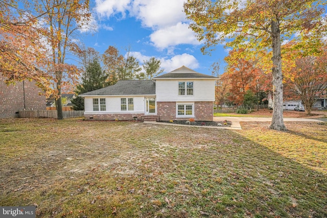 view of front of home with a front yard