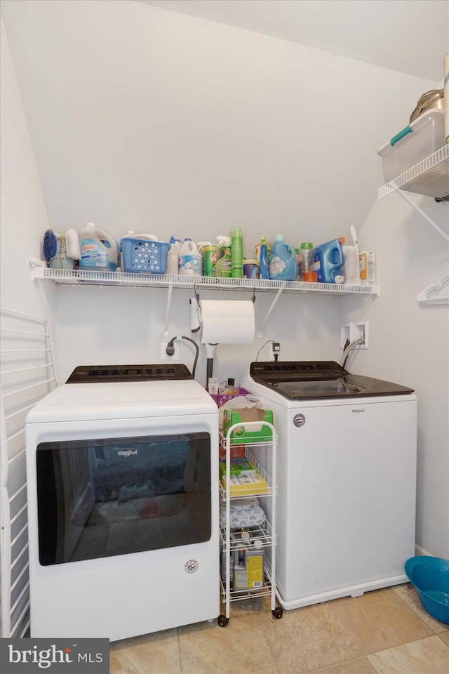 washroom with washer and dryer and light tile patterned flooring