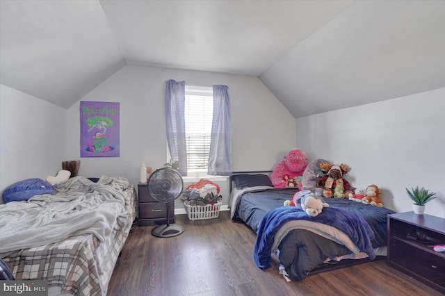 bedroom with vaulted ceiling and dark hardwood / wood-style flooring