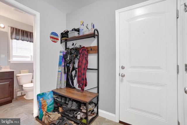 mudroom featuring light tile patterned flooring