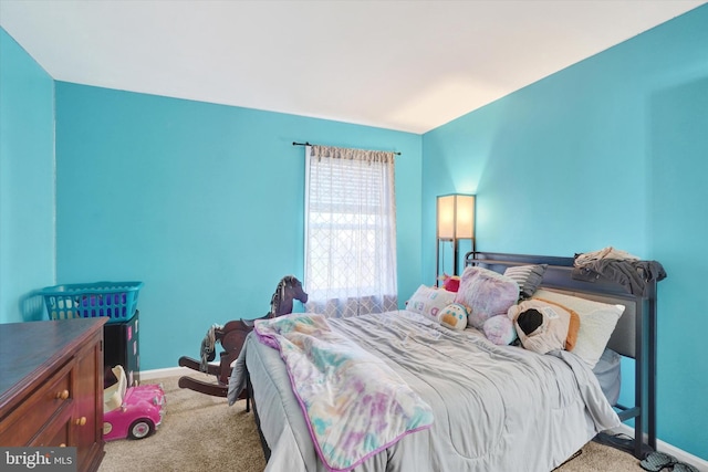 bedroom with light colored carpet