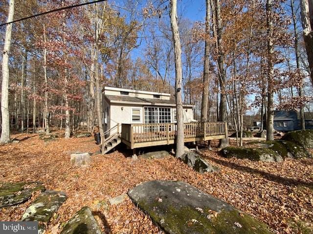 view of front of property with a wooden deck