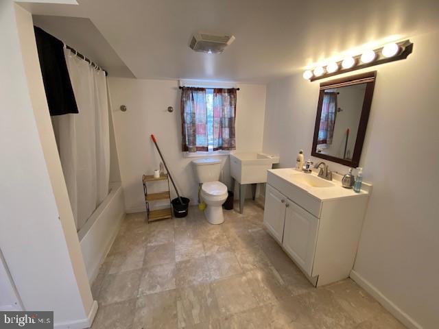 full bathroom with toilet, vanity, and shower / bathtub combination with curtain