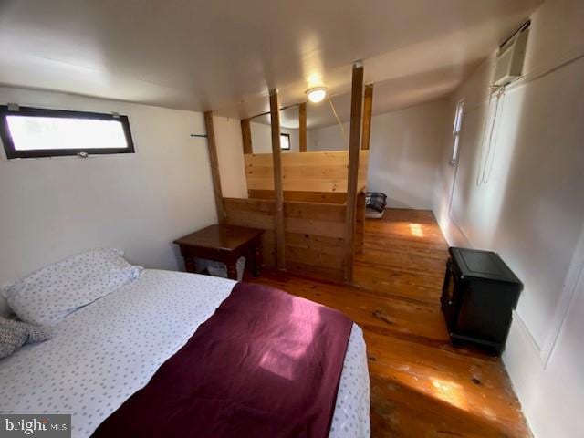 bedroom with hardwood / wood-style floors