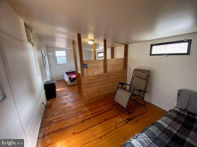 sitting room with hardwood / wood-style flooring and plenty of natural light