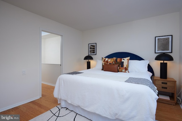 bedroom featuring light wood-type flooring