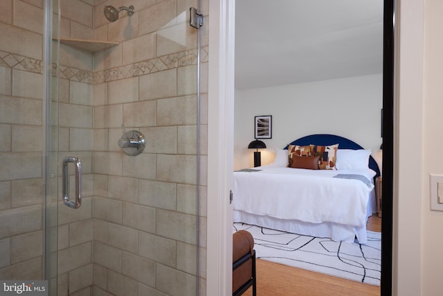 bedroom with hardwood / wood-style floors and a closet